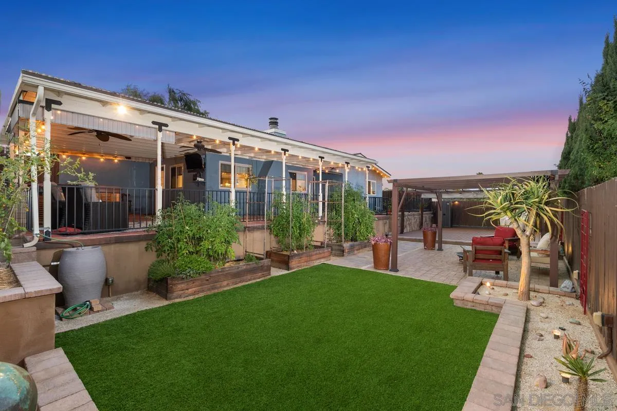 9469 Pike Road Santee, CA 92071 - Photo 37 of 39 a view of a patio with chairs and floor to ceiling window