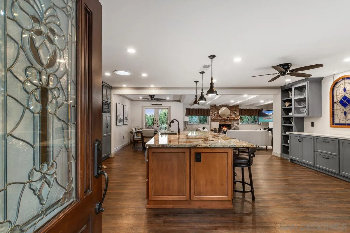 9469 Pike Road Santee, CA 92071 - Photo 4 of 39 a kitchen with a sink and wooden floor