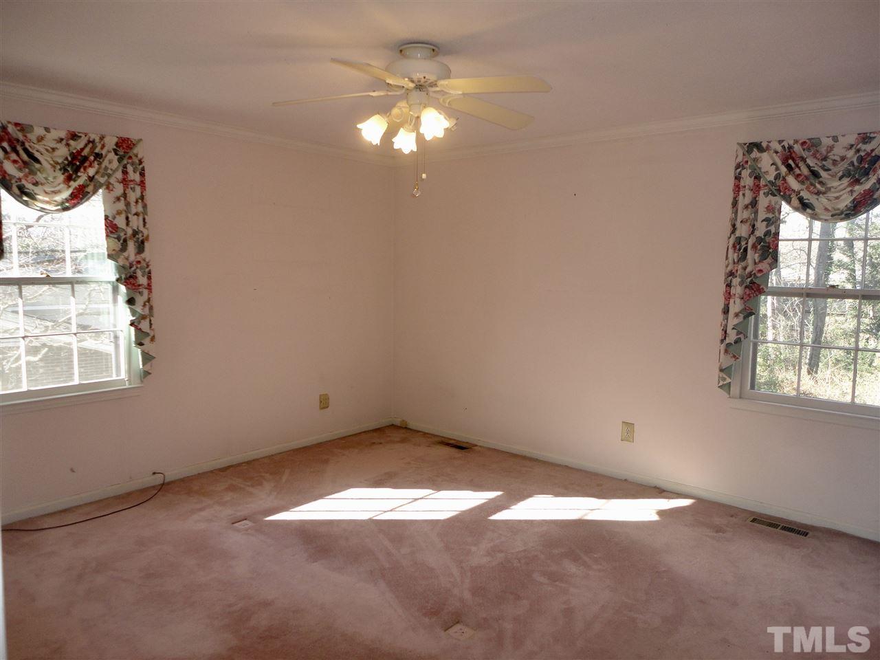 2907 New Hope Church Road Raleigh, NC 27604 - Photo 14 of 25 an empty room with windows and fan