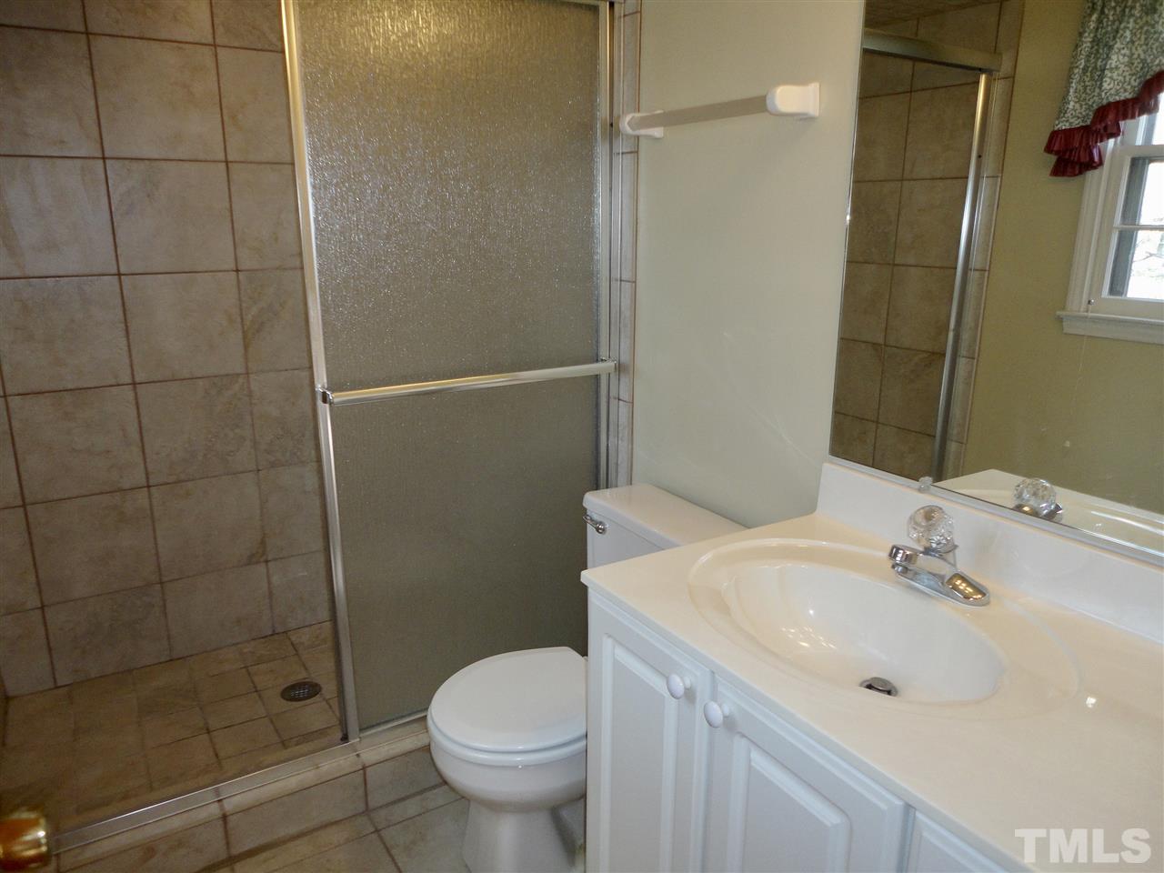 2907 New Hope Church Road Raleigh, NC 27604 - Photo 15 of 25 a bathroom with a sink toilet and shower