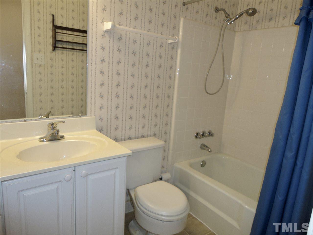 2907 New Hope Church Road Raleigh, NC 27604 - Photo 18 of 25 a bathroom with a sink a toilet and shower