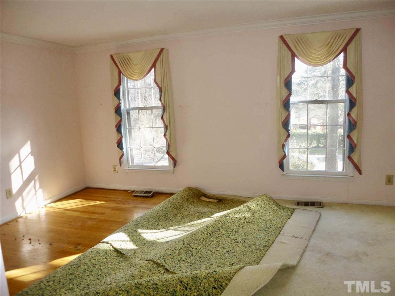2907 New Hope Church Road Raleigh, NC 27604 - Photo 4 of 25 a bedroom with a bed and a window