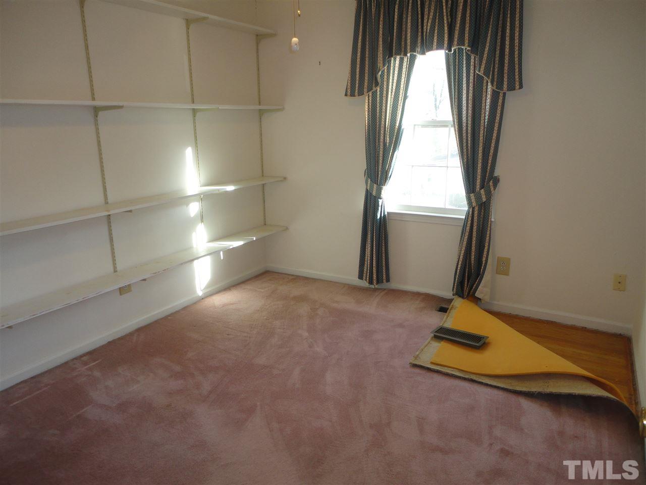 2907 New Hope Church Road Raleigh, NC 27604 - Photo 5 of 25 a view of a room with gym equipment and a window