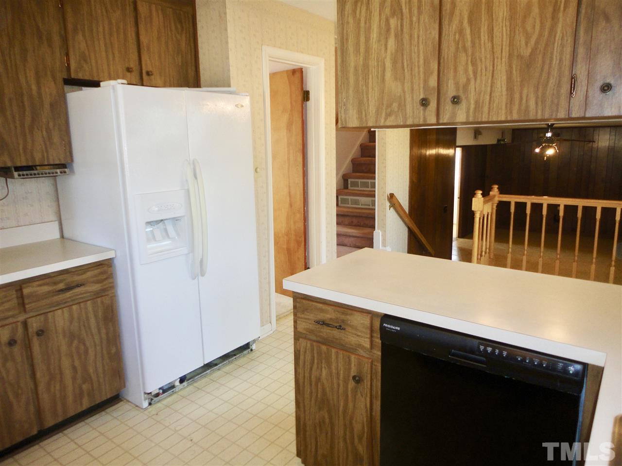2907 New Hope Church Road Raleigh, NC 27604 - Photo 7 of 25 a kitchen with stainless steel appliances a refrigerator and a stove