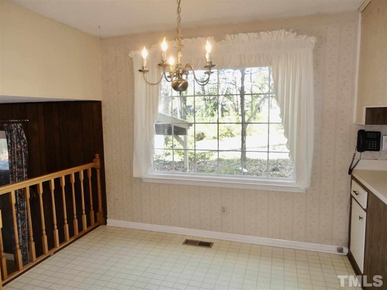 2907 New Hope Church Road Raleigh, NC 27604 - Photo 9 of 25 a view of a livingroom with a window and wooden floor