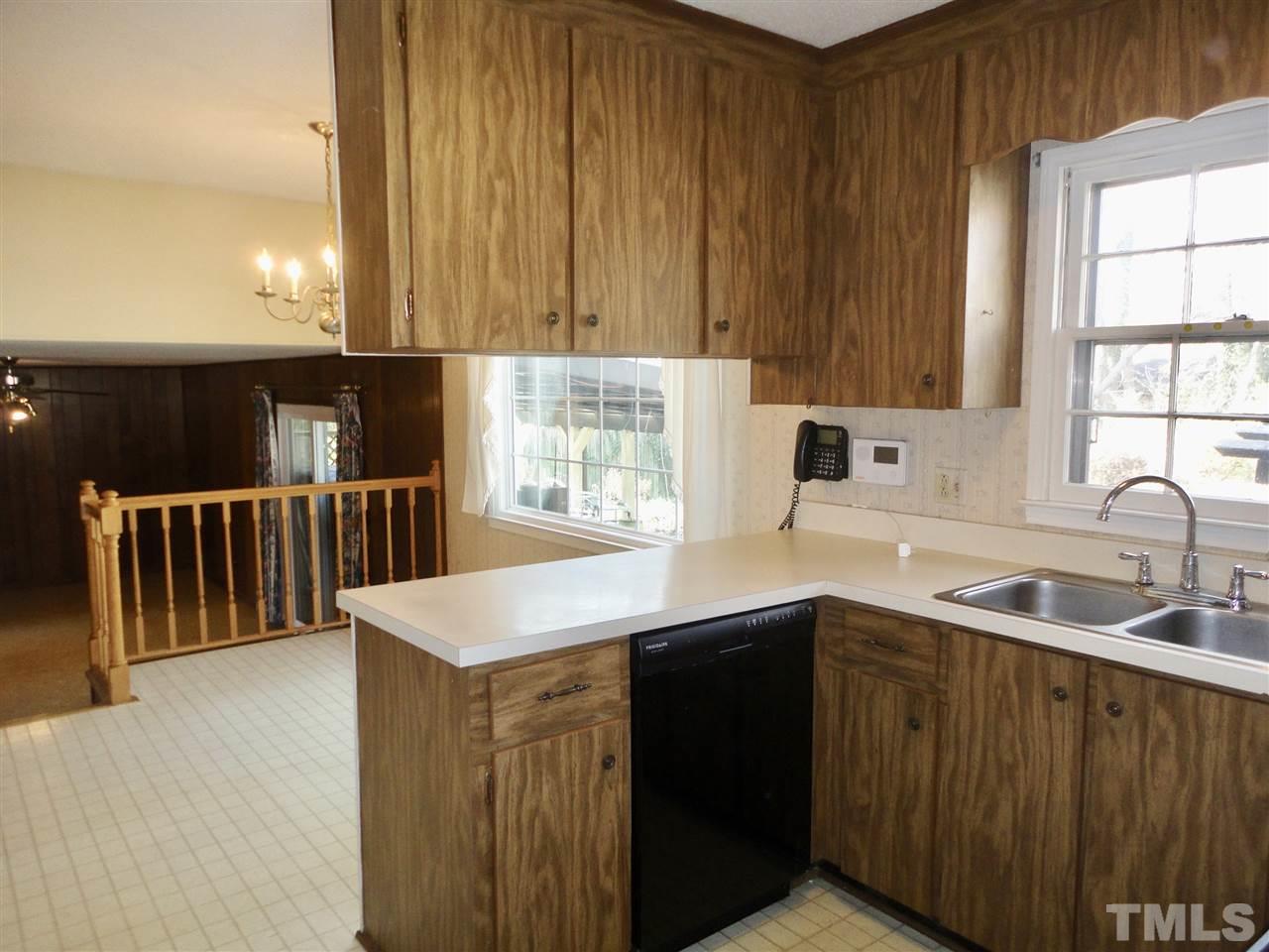 2907 New Hope Church Road Raleigh, NC 27604 - Photo 10 of 25 a kitchen with a sink and cabinets