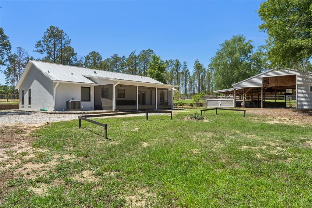 20701 County Road 44A Eustis, FL 32736 - Photo 29 of 73 a view of a house with a backyard porch and sitting area