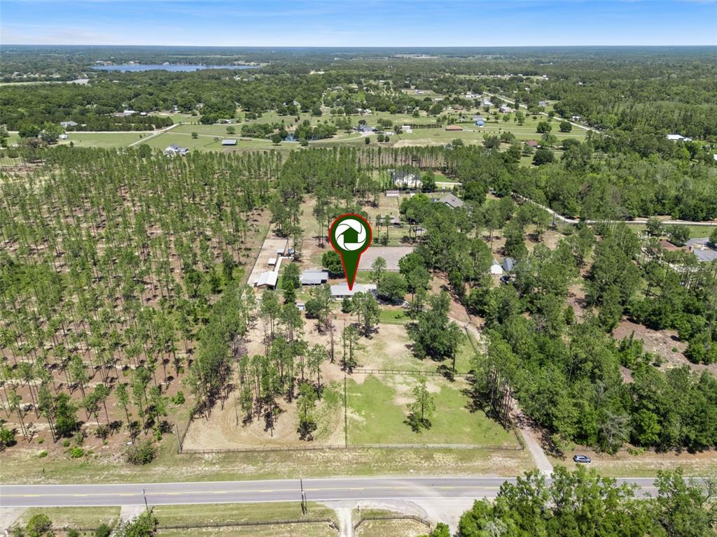 20701 County Road 44A Eustis, FL 32736 - Photo 6 of 73 an aerial view of residential houses with outdoor space and trees