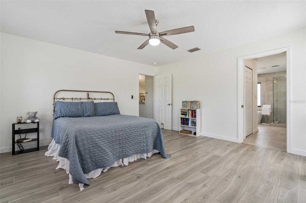 20701 County Road 44A Eustis, FL 32736 - Photo 61 of 73 a bedroom with a bed and a ceiling fan