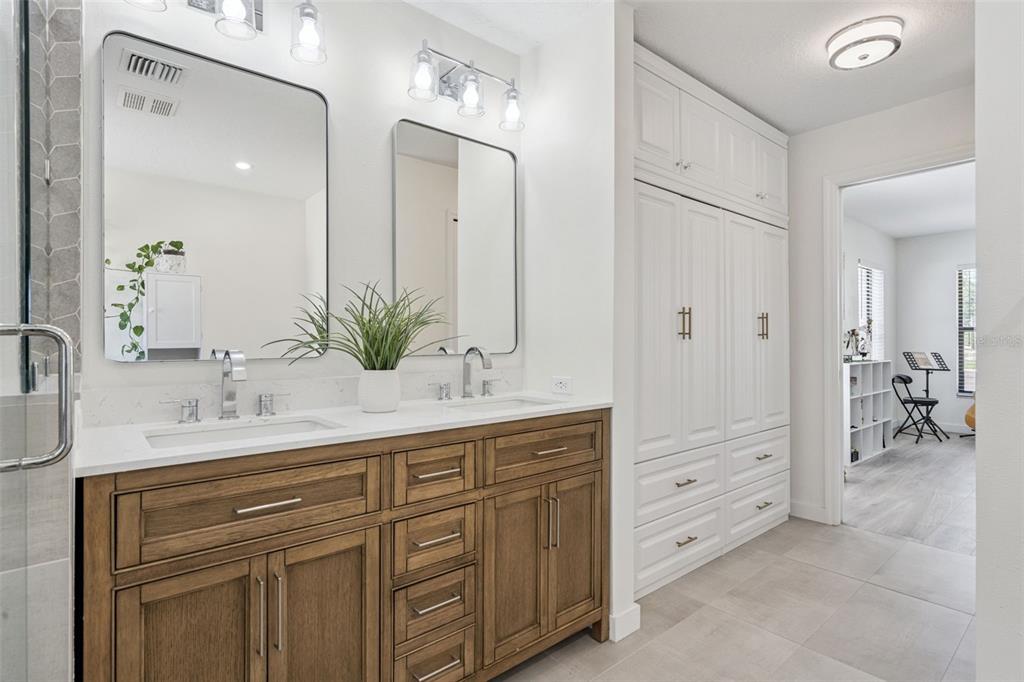 20701 County Road 44A Eustis, FL 32736 - Photo 64 of 73 a bathroom with a granite countertop sink double and mirror