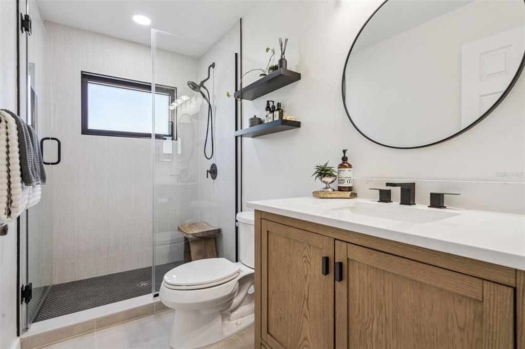 20701 County Road 44A Eustis, FL 32736 - Photo 67 of 73 a bathroom with a sink a toilet and a mirror