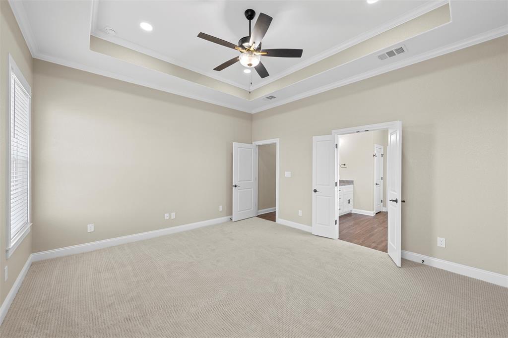 109 Water View Lane Robinson, TX 76706 - Photo 13 of 35 an empty room and a ceiling fan in hallway