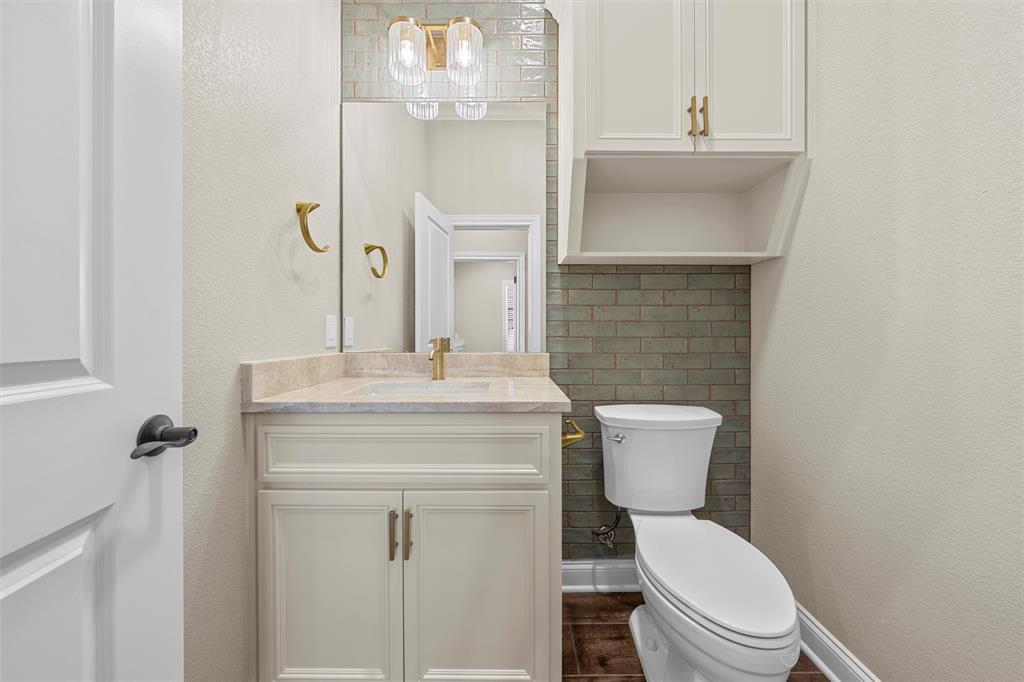 109 Water View Lane Robinson, TX 76706 - Photo 23 of 35 a bathroom with a toilet sink and mirror