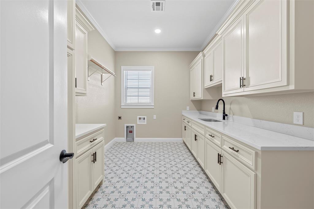 109 Water View Lane Robinson, TX 76706 - Photo 24 of 35 a large white kitchen with granite countertop a sink dishwasher a stove and a refrigerator with wooden floor
