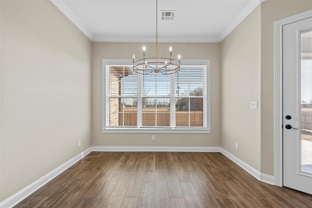 109 Water View Lane Robinson, TX 76706 - Photo 25 of 35 wooden floor in an empty room with a window