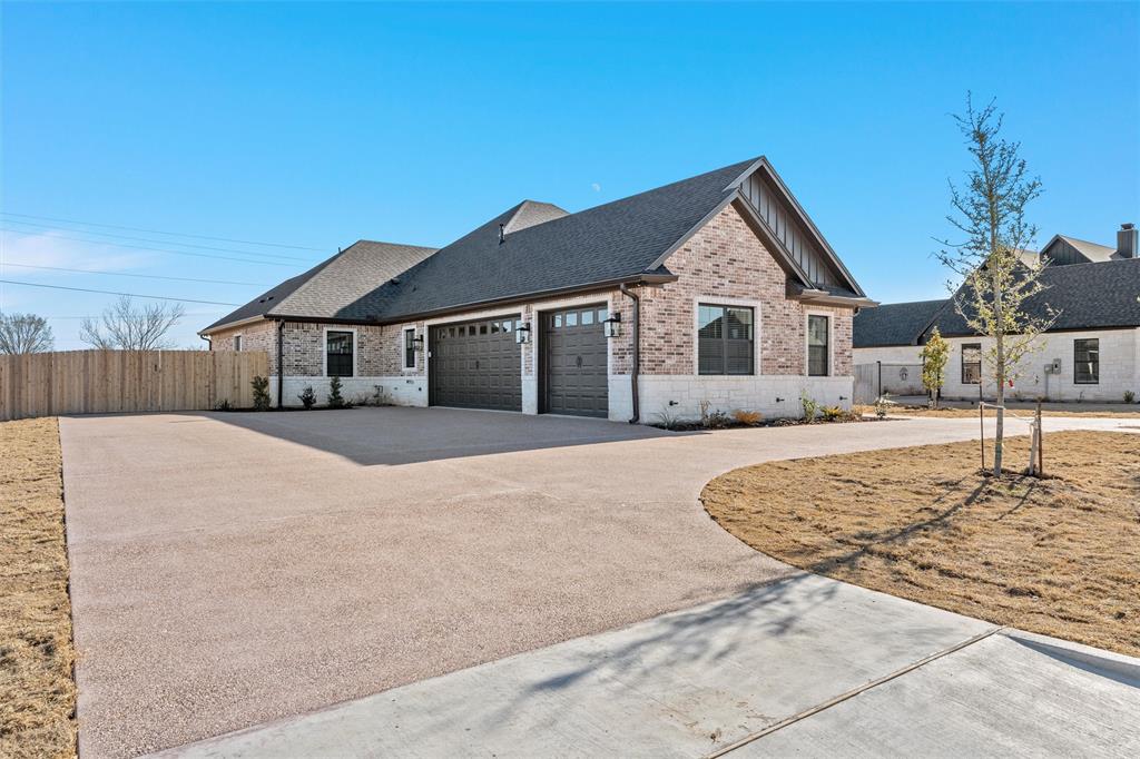 109 Water View Lane Robinson, TX 76706 - Photo 29 of 35 a house with a garden
