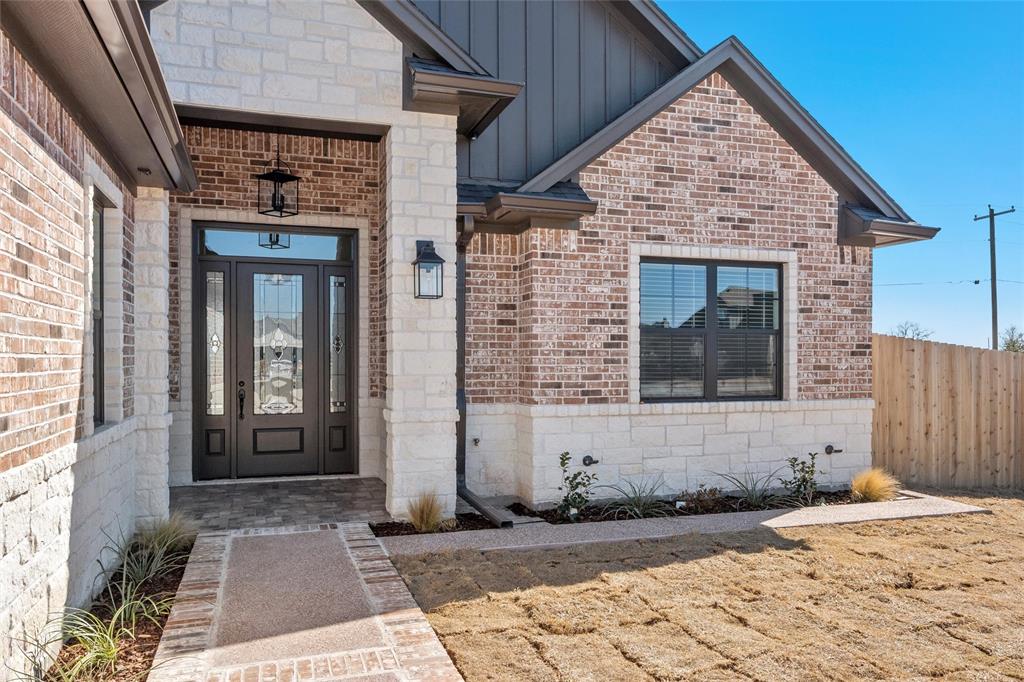 109 Water View Lane Robinson, TX 76706 - Photo 3 of 35 a front view of a house with a yard
