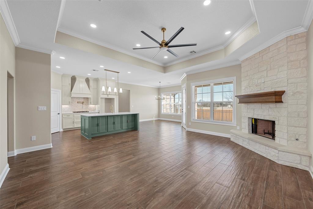 109 Water View Lane Robinson, TX 76706 - Photo 5 of 35 an empty room with wooden floor fireplace and windows