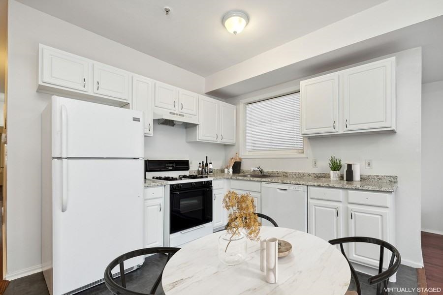 64 James Street, Unit 2 Newark, NJ 07102 - Photo 4 of 9 a kitchen with a sink appliances and cabinets