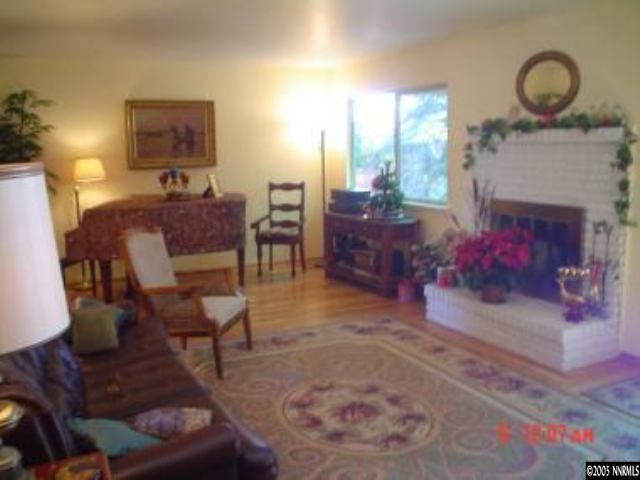 1500 Belford Road Reno, NV 89509 - Photo 2 of 7 a living room with furniture and a fireplace