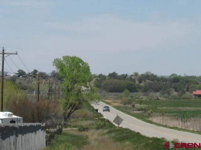 a view of a town with mountains in the background
