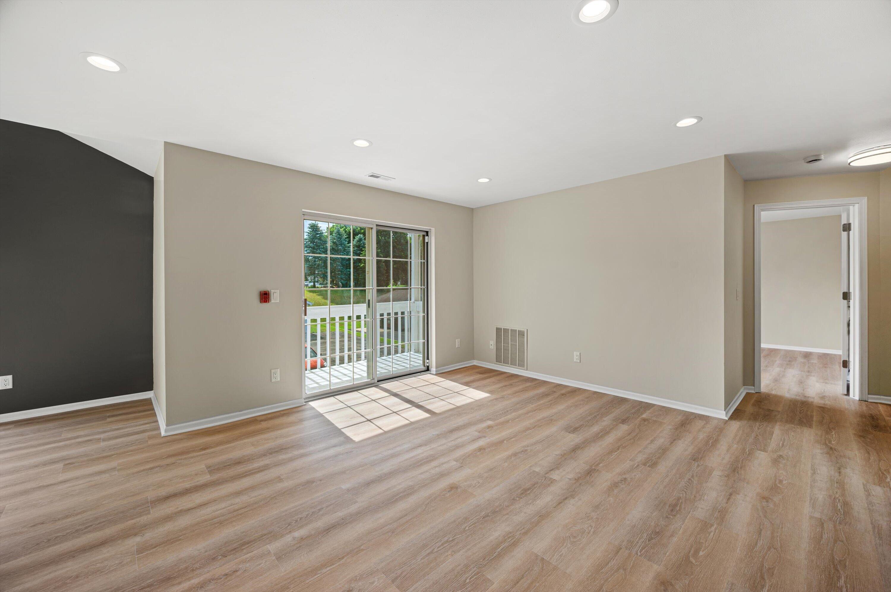 1848 Division Street, Unit 8 East Troy, WI 53120 - Photo 5 of 24 05-Living Room w_ Patio Doors