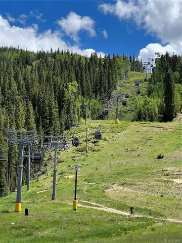 a room with furniture pool table table tennis table screen and windows