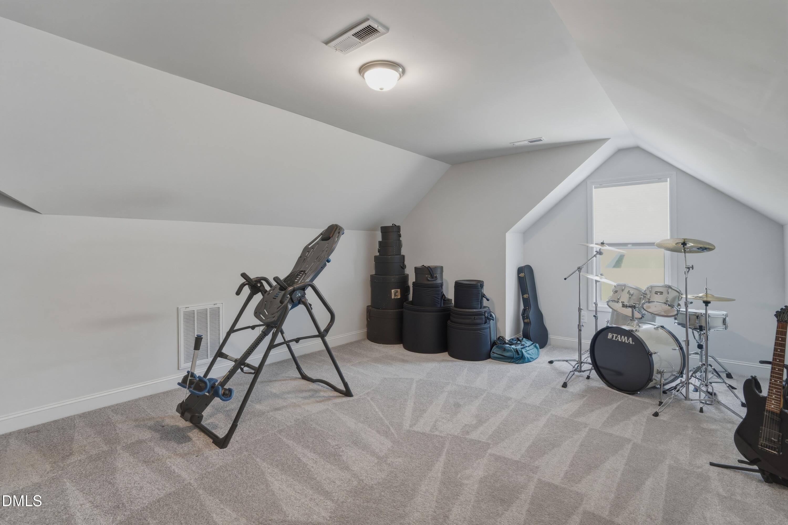 386 Howards Crossing Drive Wendell, NC 27591 - Photo 18 of 31 a view of a room with gym equipment
