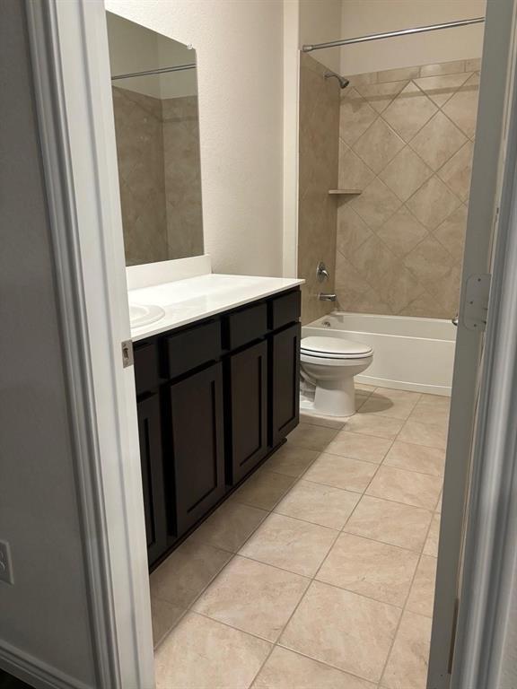 4617 Azurite Road Little Elm, TX 76227 - Photo 8 of 12 a bathroom with a sink a toilet and shower