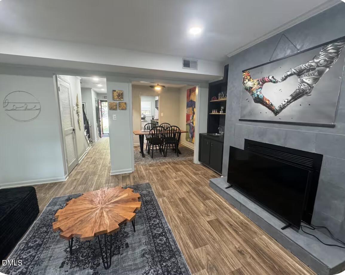 6369 New Market Way Raleigh, NC 27615 - Photo 2 of 14 a living room with furniture and a fireplace