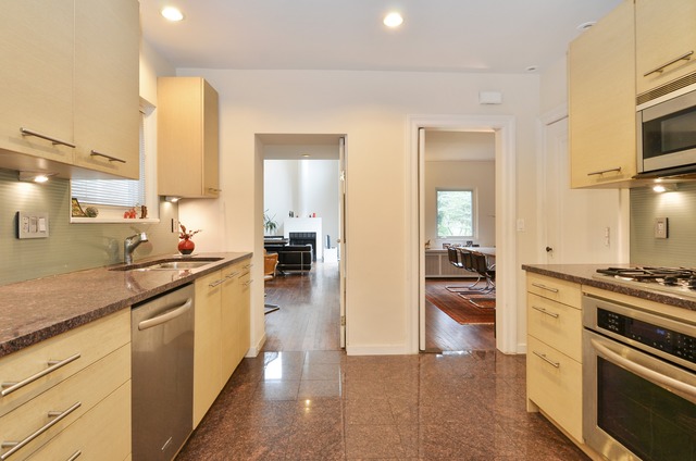 63 Abbotsford Road Winnetka, IL 60093 - Photo 12 of 25 a kitchen with stainless steel appliances a stove sink and cabinets