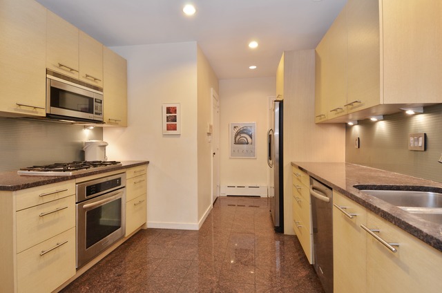 63 Abbotsford Road Winnetka, IL 60093 - Photo 13 of 25 a kitchen with stainless steel appliances granite countertop a stove a sink and a refrigerator