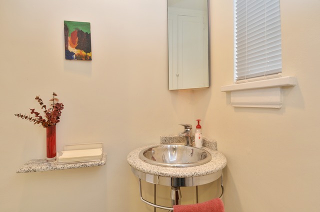 63 Abbotsford Road Winnetka, IL 60093 - Photo 15 of 25 a bathroom with a sink and a mirror