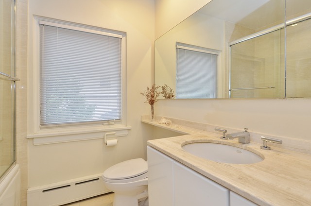 63 Abbotsford Road Winnetka, IL 60093 - Photo 20 of 25 a bathroom with a granite countertop sink toilet and shower