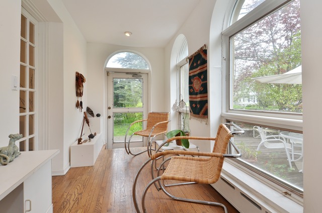 63 Abbotsford Road Winnetka, IL 60093 - Photo 6 of 25 a living room with furniture fireplace and a large window