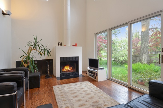 63 Abbotsford Road Winnetka, IL 60093 - Photo 7 of 25 a living room with furniture and a fireplace