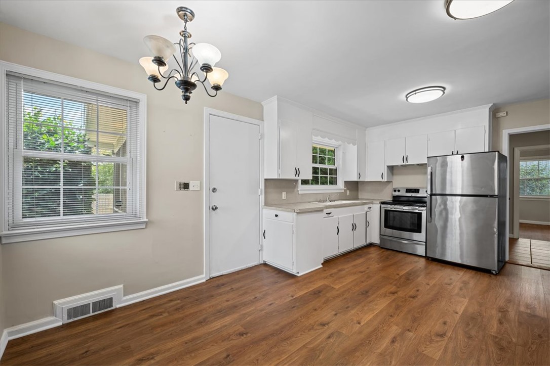 212 East Shockley Ferry Road Anderson, SC 29624 - Photo 8 of 28 A well-appointed kitchen offers ample cabinetry, stainless steel appliances, and a welcoming dining area.