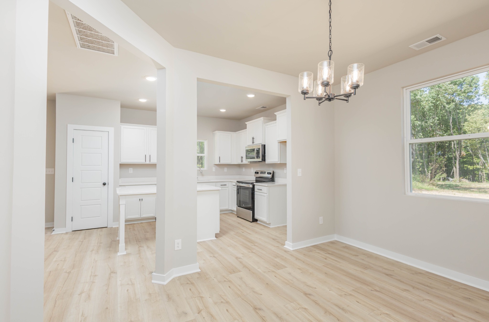 0 Poplar Way Dickson, TN 37055 - Photo 11 of 49 a view of a kitchen with center island wooden floor and a window