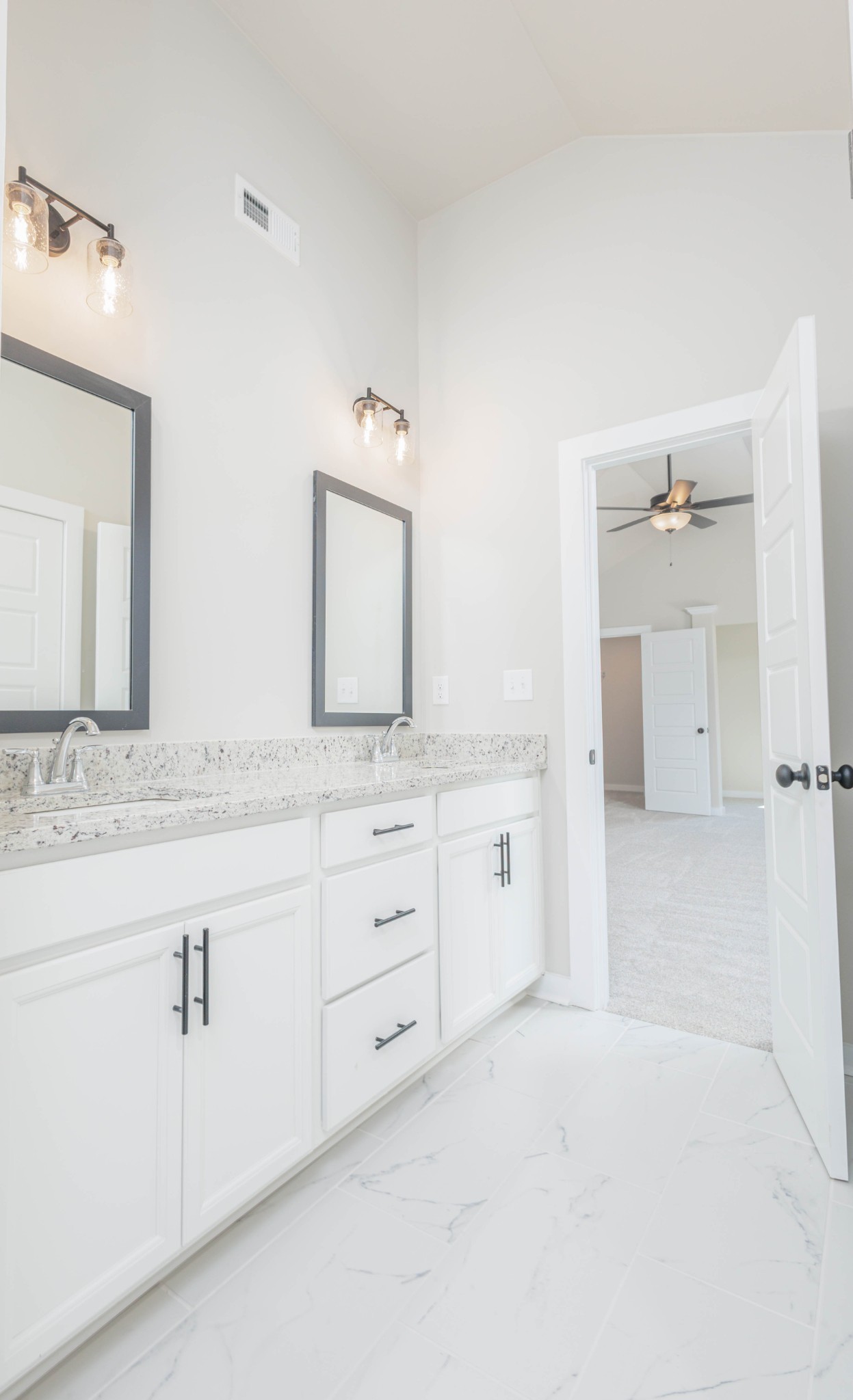 0 Poplar Way Dickson, TN 37055 - Photo 32 of 49 a spacious bathroom with a granite countertop sink and a mirror