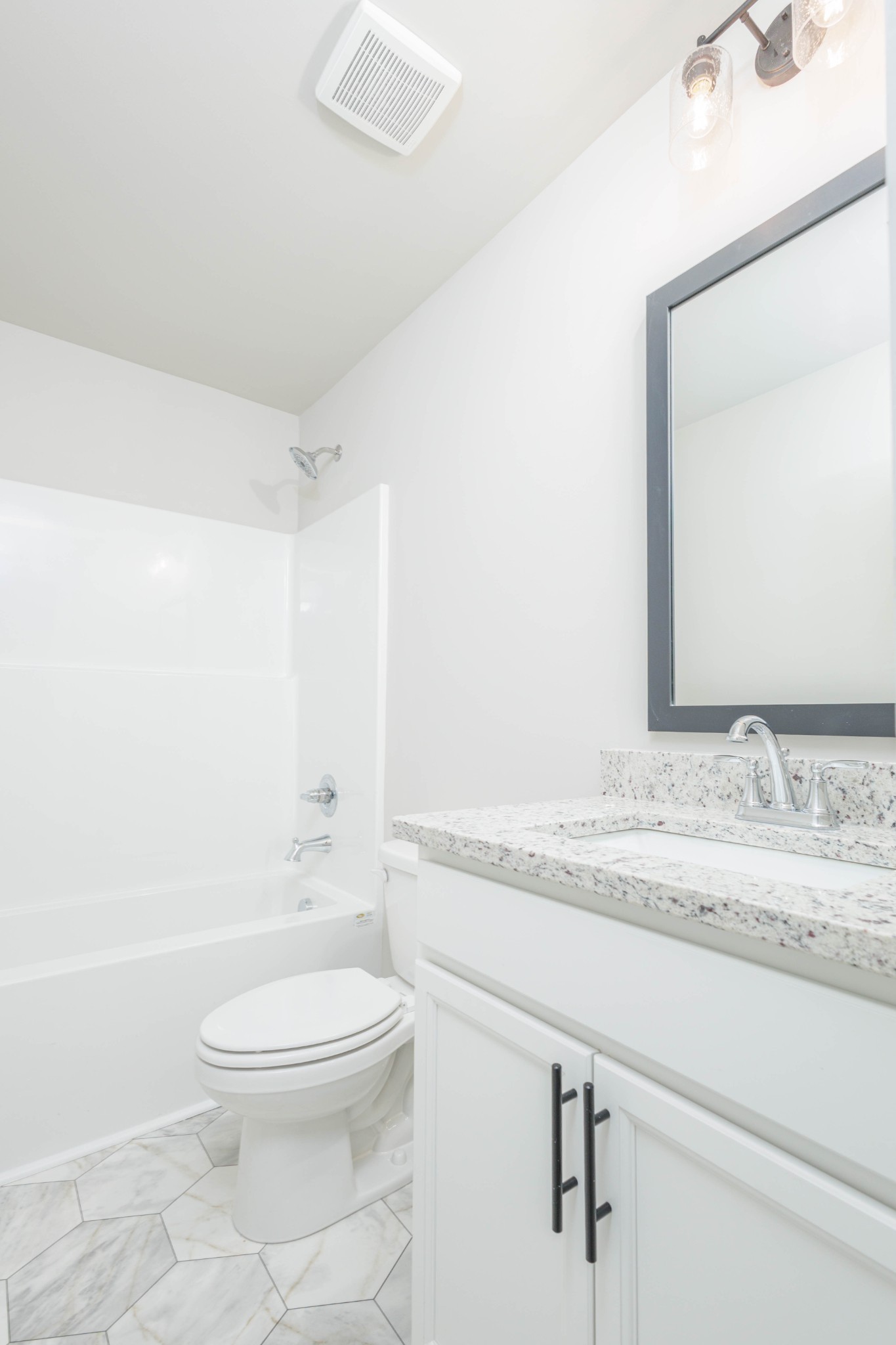 0 Poplar Way Dickson, TN 37055 - Photo 38 of 49 a bathroom with a granite countertop sink a toilet and a bathtub