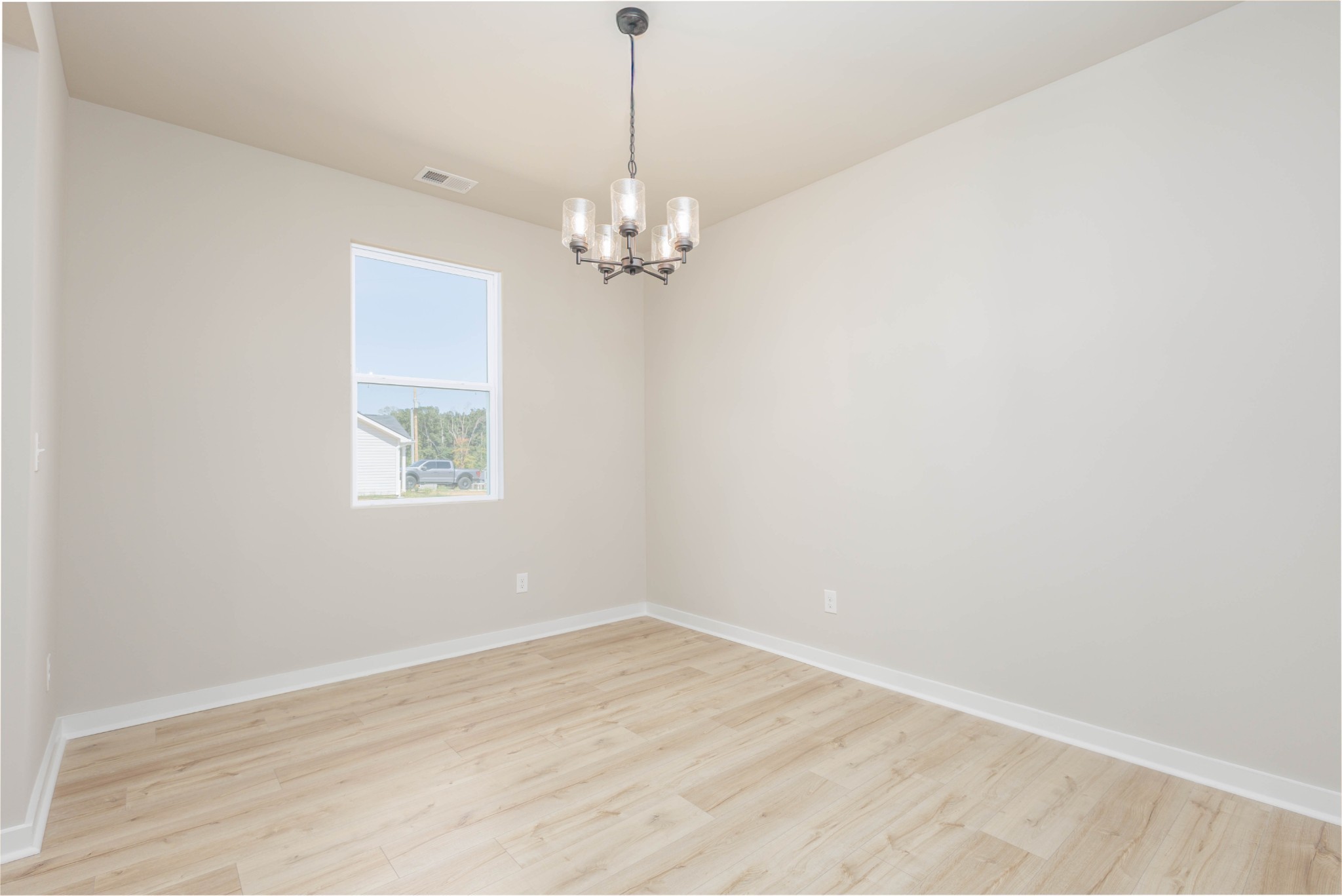 0 Poplar Way Dickson, TN 37055 - Photo 8 of 49 an empty room with wooden floor chandelier fan and windows