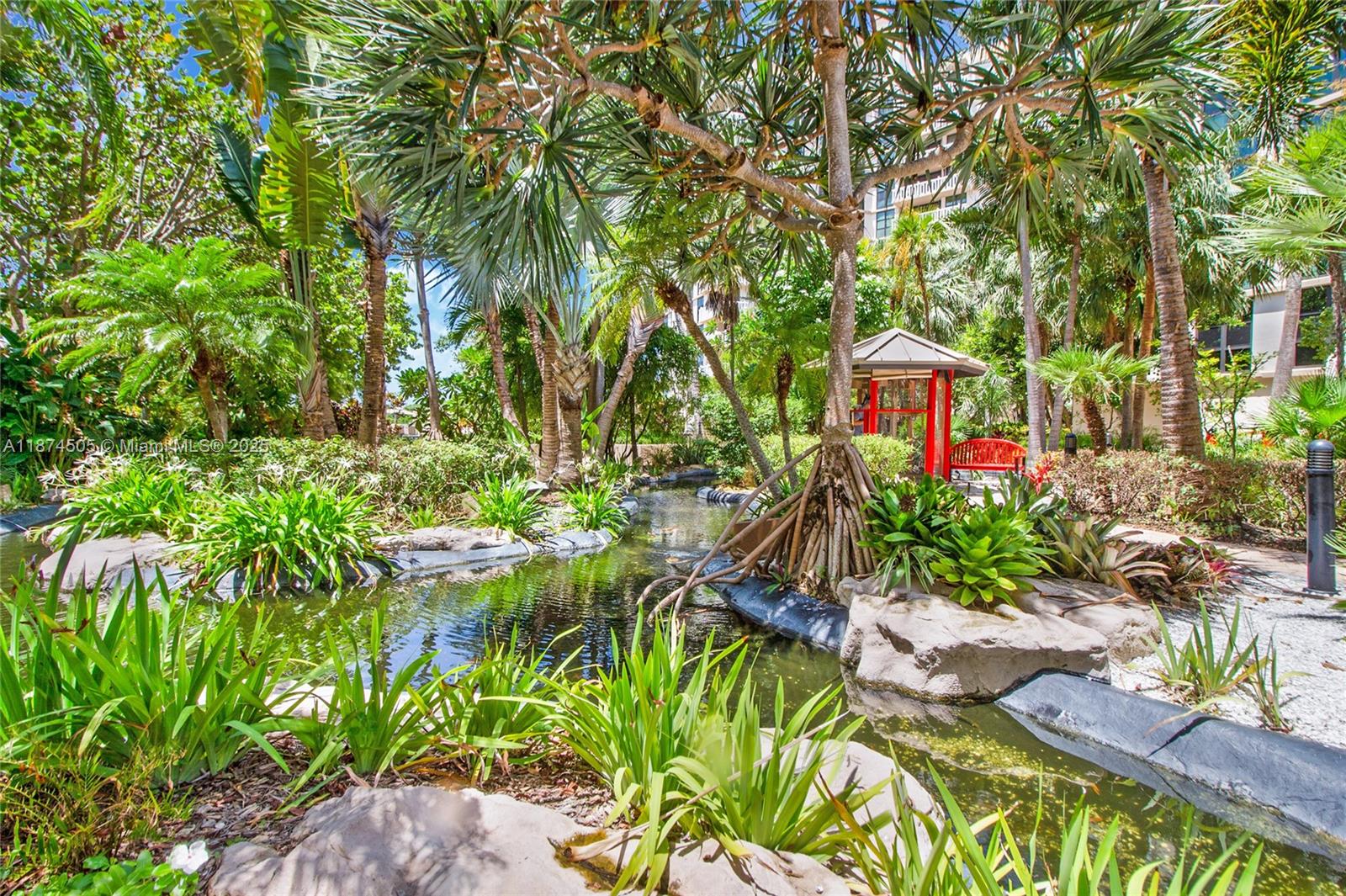 1111 Crandon Boulevard, Unit B606 Key Biscayne, FL 33149 - Photo 12 of 33 a house with lots of trees