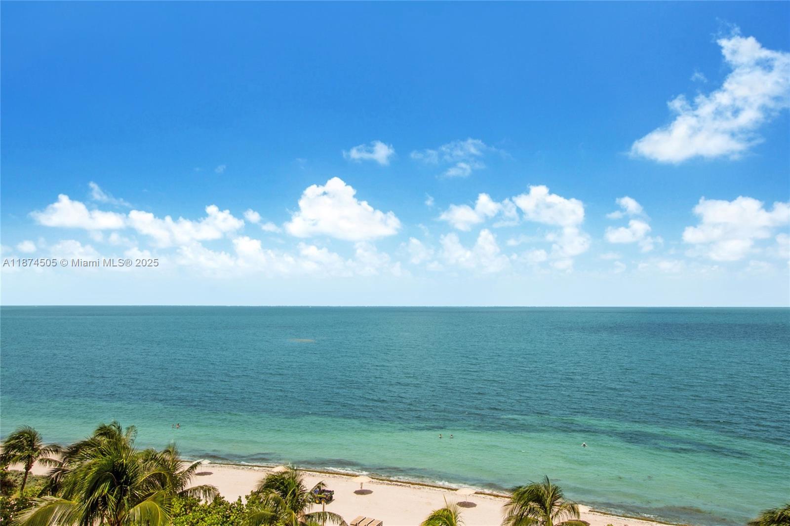 1111 Crandon Boulevard, Unit B606 Key Biscayne, FL 33149 - Photo 14 of 33 a view of a lake and a yard