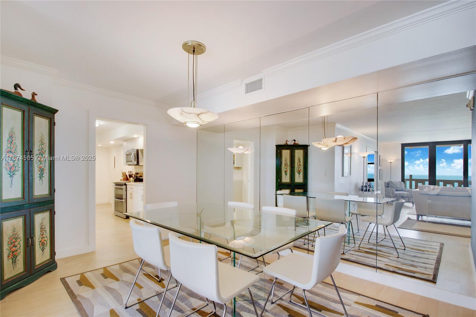 1111 Crandon Boulevard, Unit B606 Key Biscayne, FL 33149 - Photo 18 of 33 a room with lots of furniture and mirrors