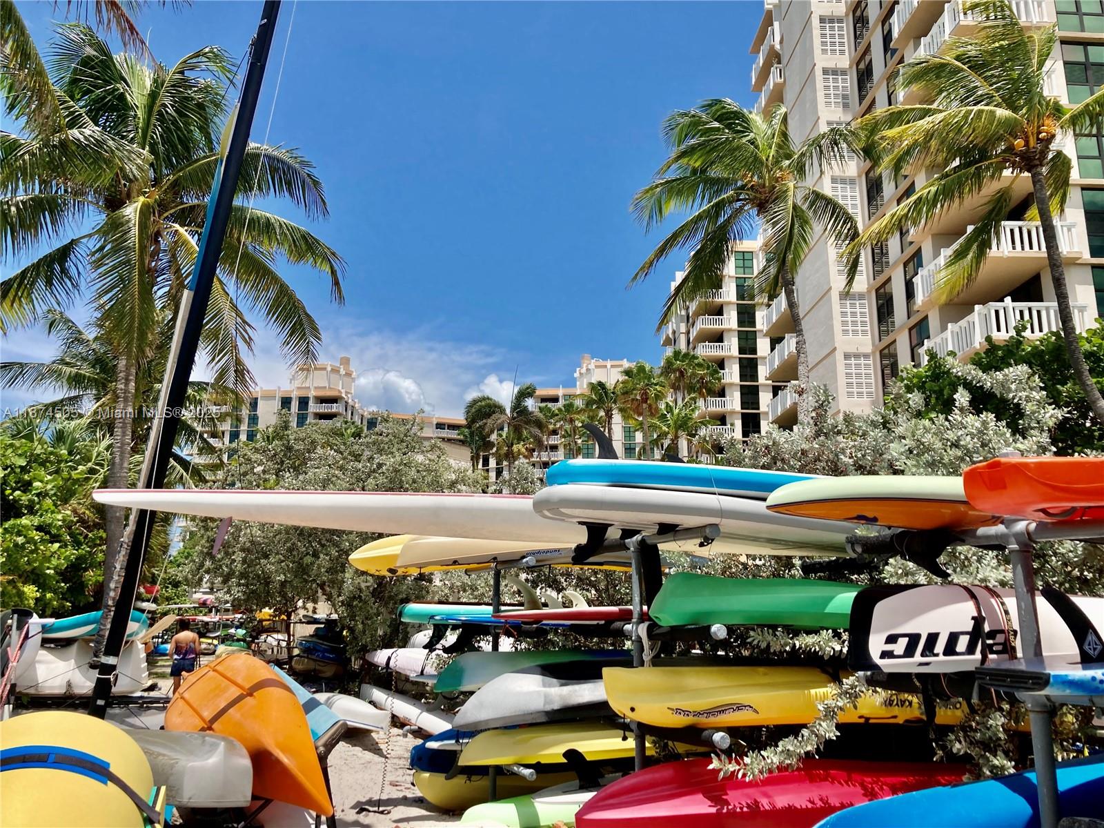 1111 Crandon Boulevard, Unit B606 Key Biscayne, FL 33149 - Photo 25 of 33 a view of an outdoor sitting area with swimming pool