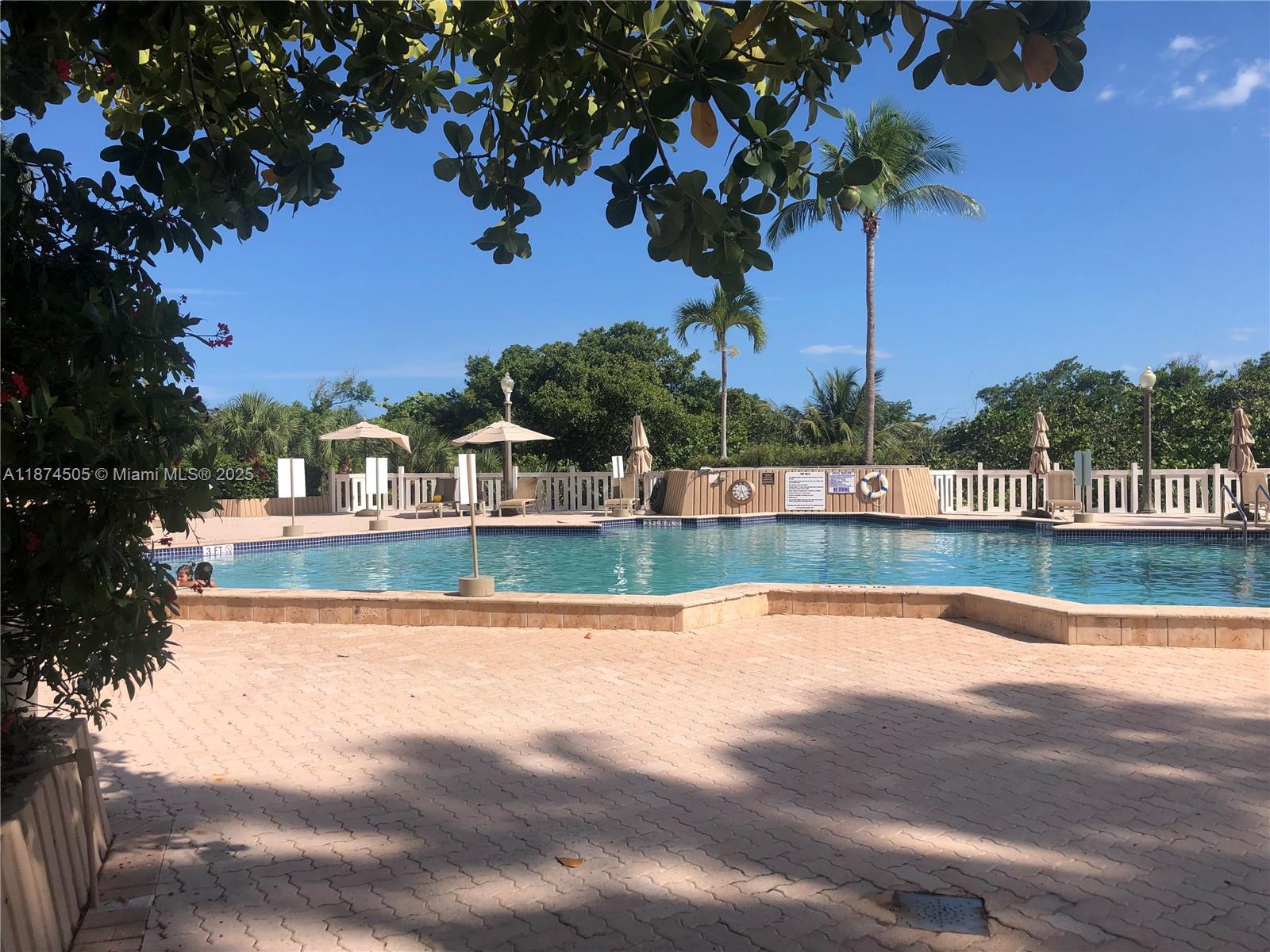 1111 Crandon Boulevard, Unit B606 Key Biscayne, FL 33149 - Photo 33 of 33 a view of swimming pool with a yard
