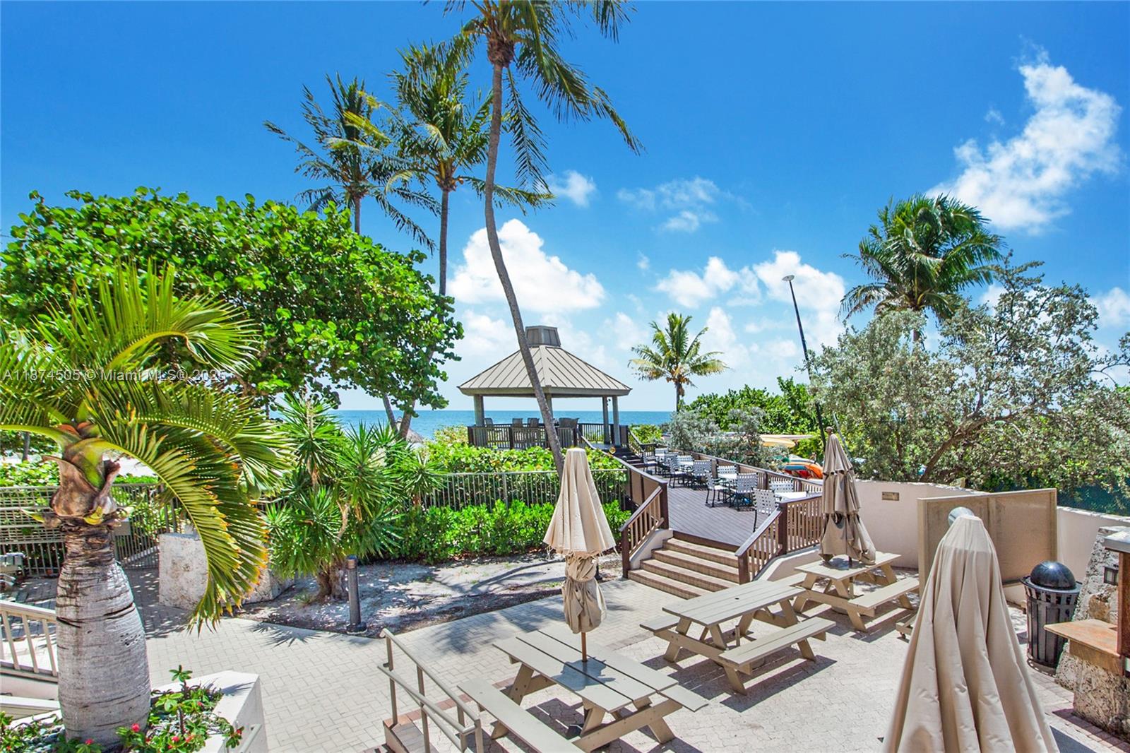 1111 Crandon Boulevard, Unit B606 Key Biscayne, FL 33149 - Photo 10 of 33 a view of a patio with furniture
