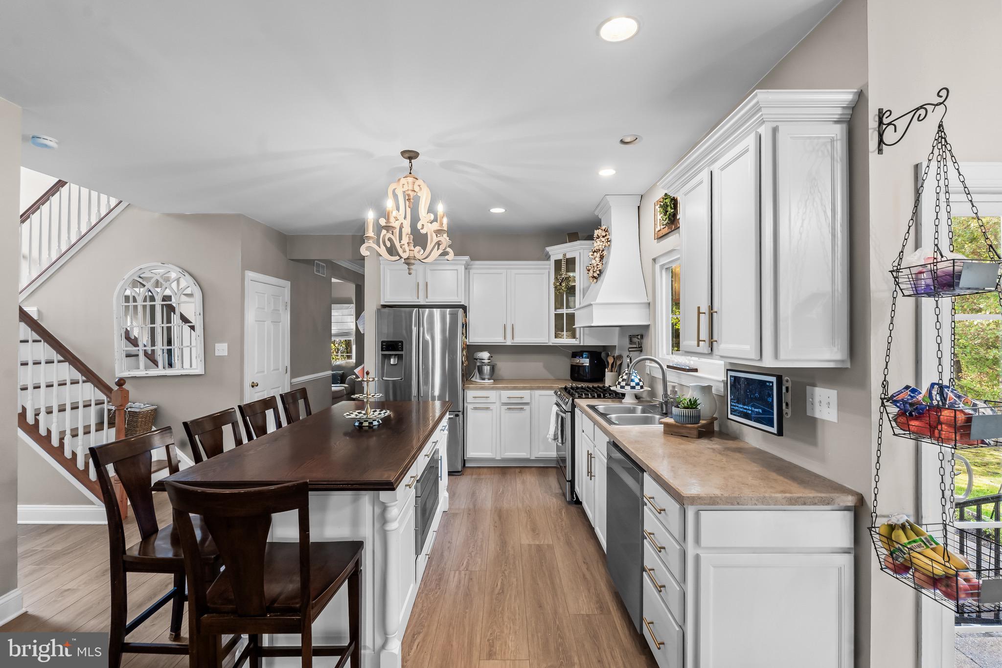 3653 Tuckahoe Road Franklinville, NJ 08322 - Photo 12 of 41 a kitchen with a table chairs stove and cabinets
