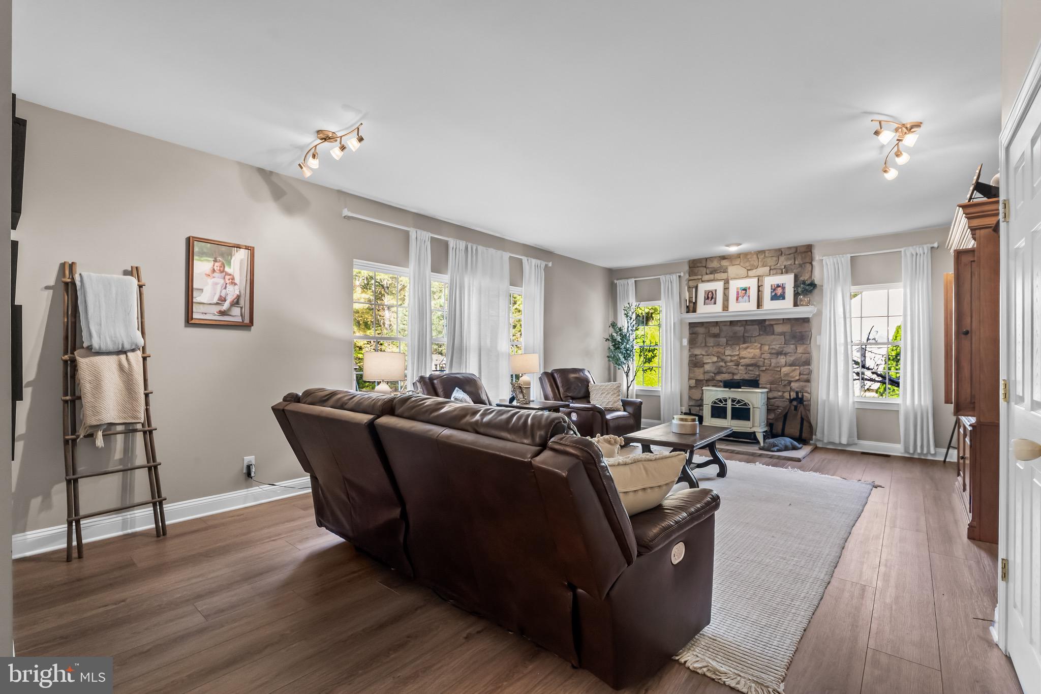 3653 Tuckahoe Road Franklinville, NJ 08322 - Photo 16 of 41 a living room with furniture and a fireplace