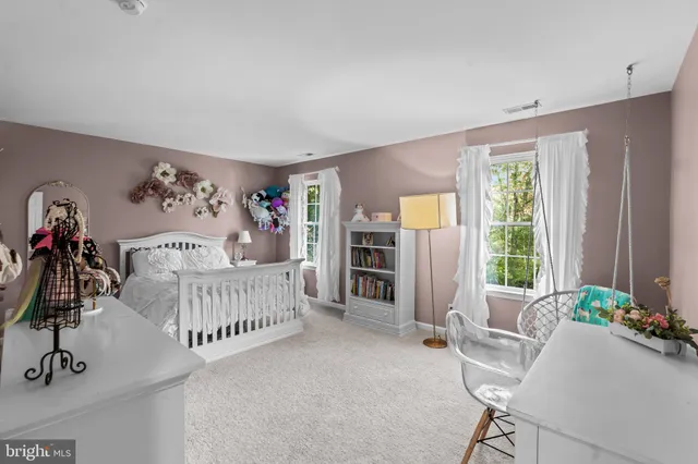 a view of a livingroom with furniture and windows